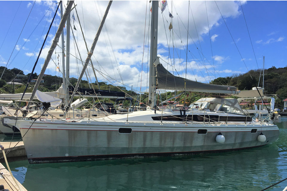 An Ovni 445 sailboat berthed alongside