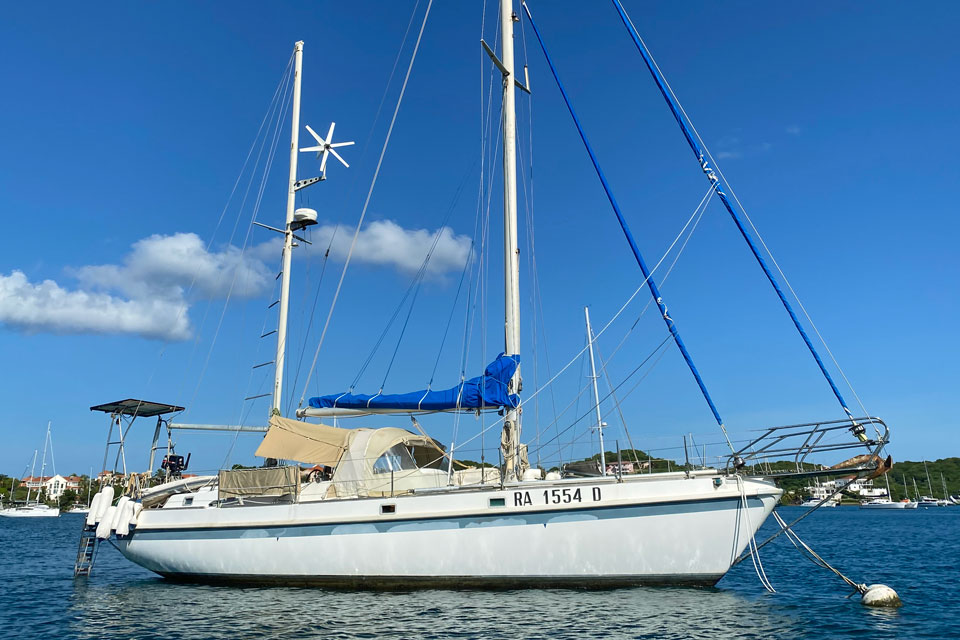 An Apla 42 ketch on a mooring ball