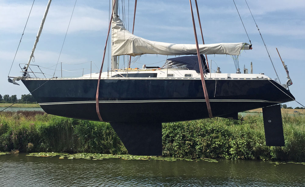 A Van de Stadt Caribbean 40 sailboat in slings