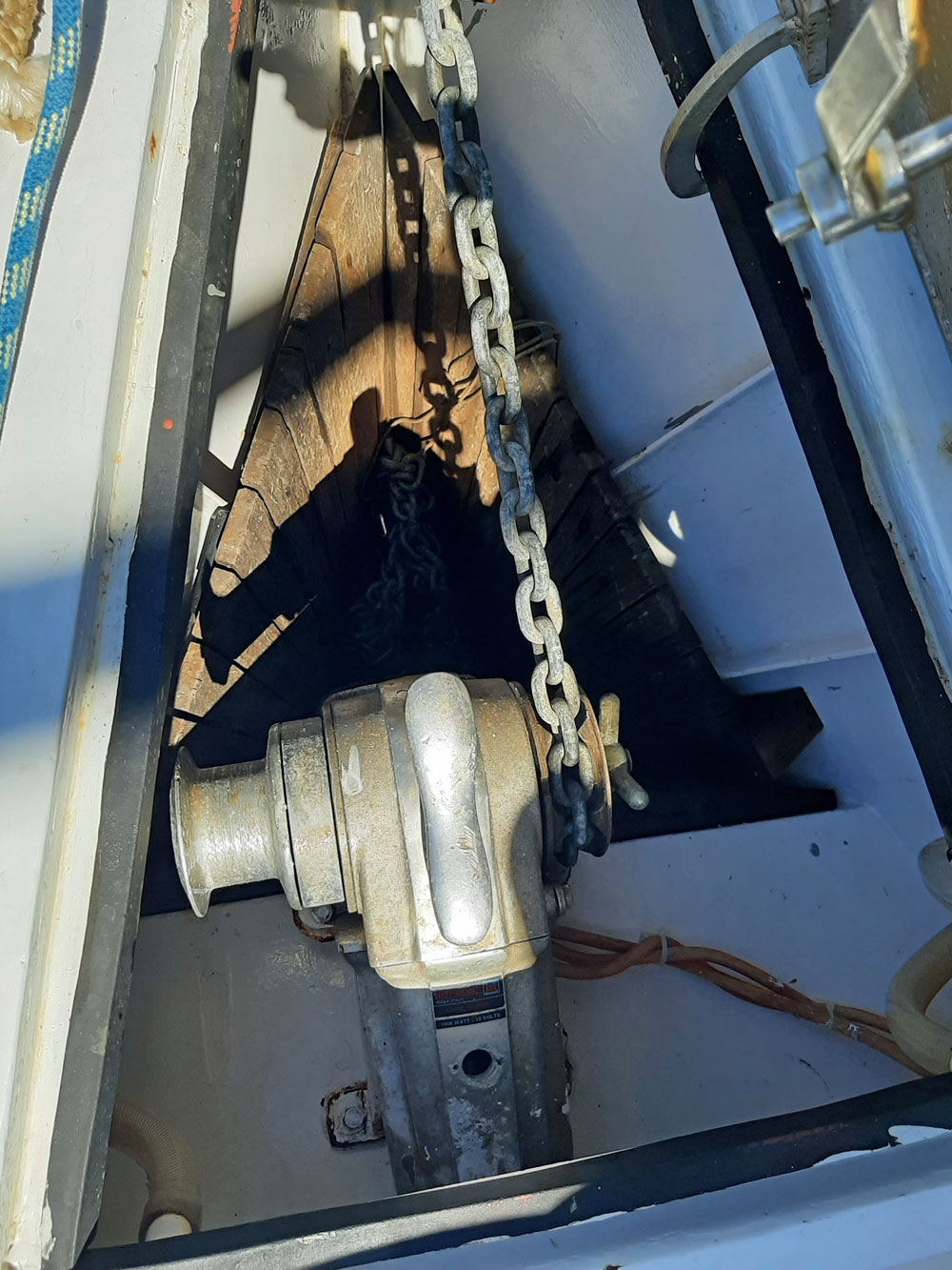 Below deck anchor windlass on sailboat